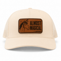 Cream trucker hat with Almost Magical leather patch