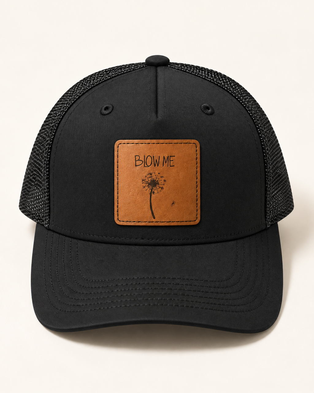 Blow Me Dandelion black trucker hat, front