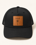Blow Me Dandelion black trucker hat, front