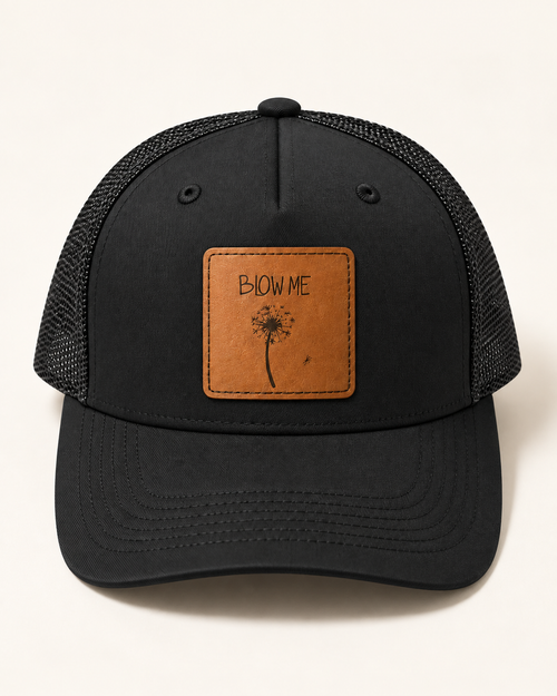 Blow Me Dandelion black trucker hat, front