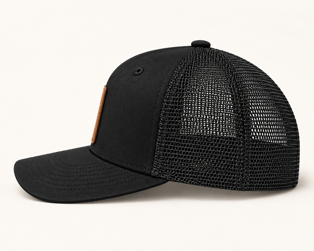 Blow Me Dandelion black trucker hat, side view