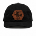 Tiny Terror black baby hat with brown patch